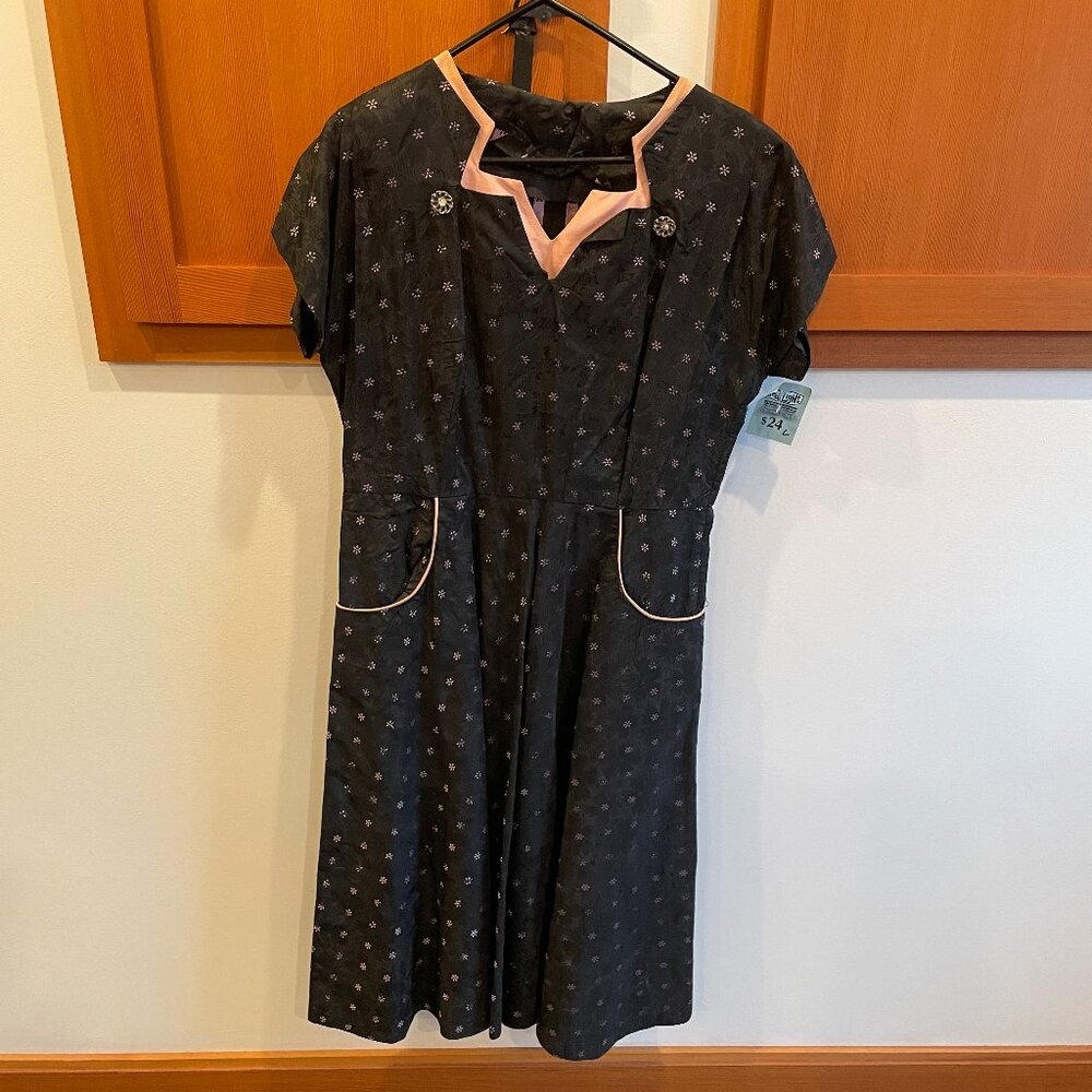 Long black dress with pink trim, belted